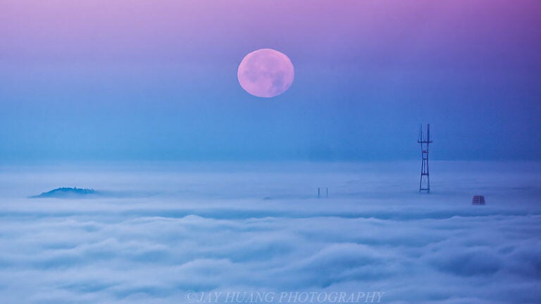 Moon setting over clouds of San Francisco