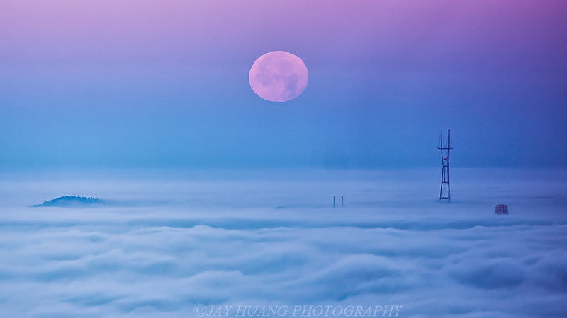 Moon setting over clouds of San Francisco