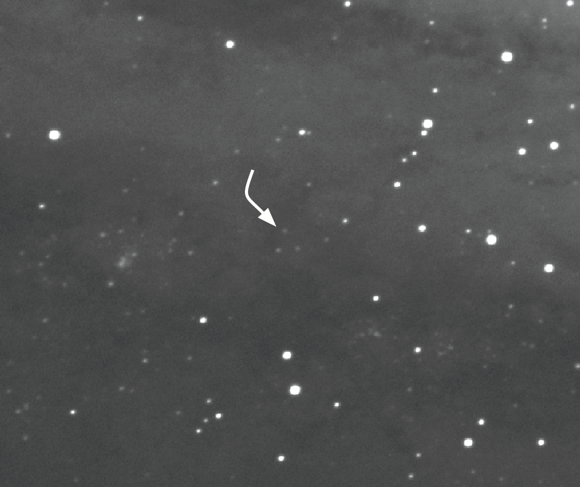 This calibrated and stacked image — greatly zoomed in — from the author’s first night of observation shows M31-V1, indicated by an arrow, as a faint dot, right where expected. 