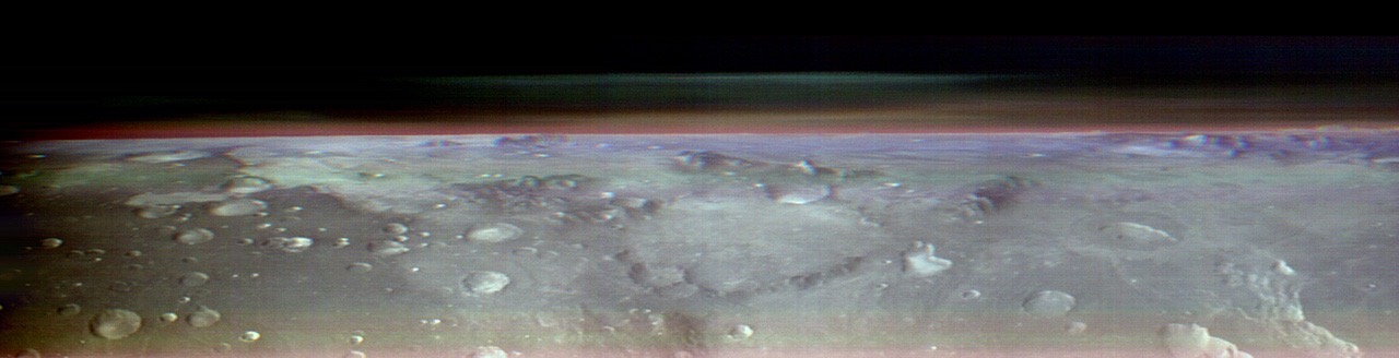 This unusual view of the horizon of Mars was captured by NASA’s Odyssey orbiter using its THEMIS camera, in an operation that took engineers three months to plan as part of the space mission. It’s taken from about 250 miles above the Martian surface – about the same altitude at which the International Space Station orbits Earth. Credit: NASA/JPL-Caltech/ASU.