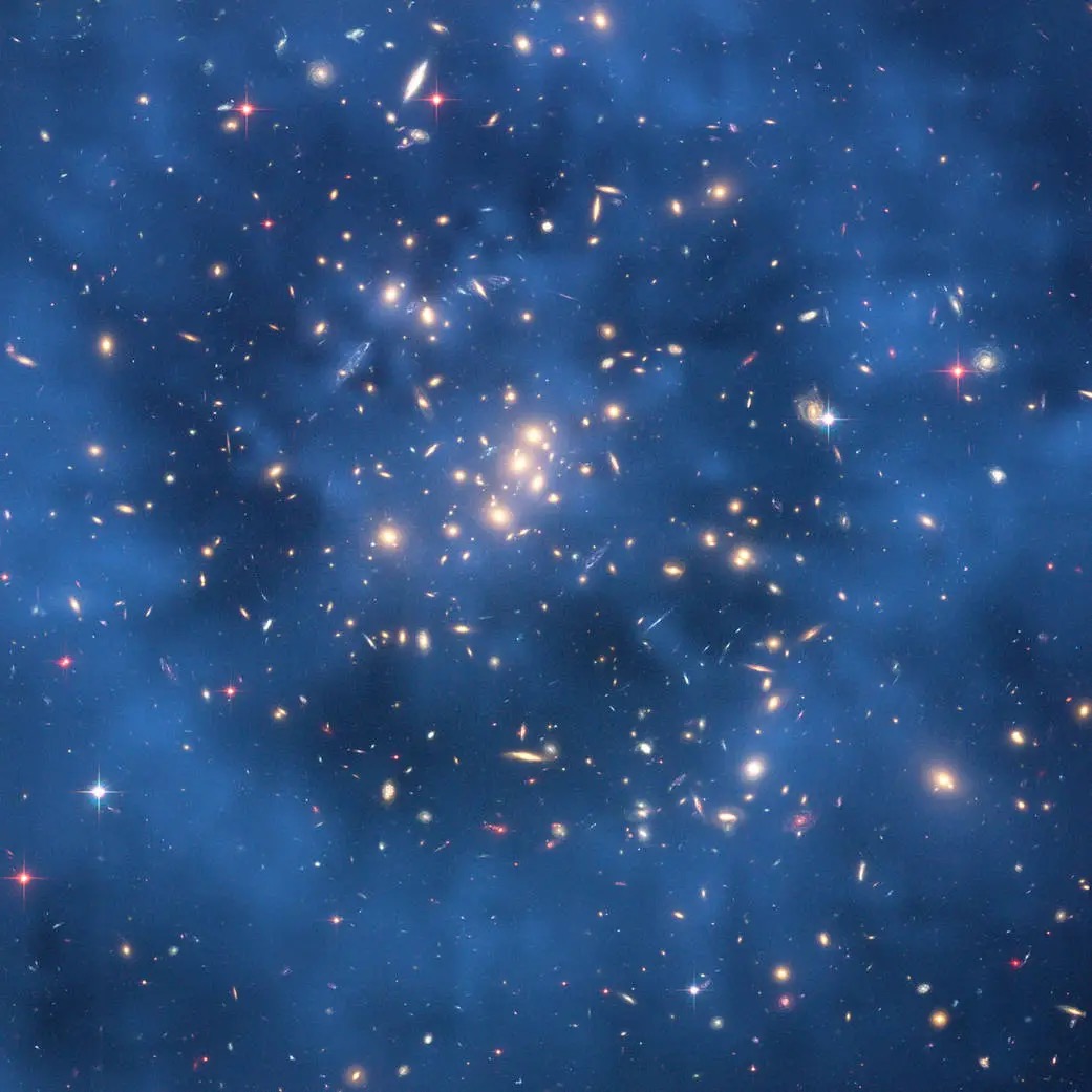 This 2008 image from the Hubble Space Telescope indicates that a huge ring of dark matter likely exists surrounding the center of CL0024+17 that has no normal matter counterpart. Credit: NASA.