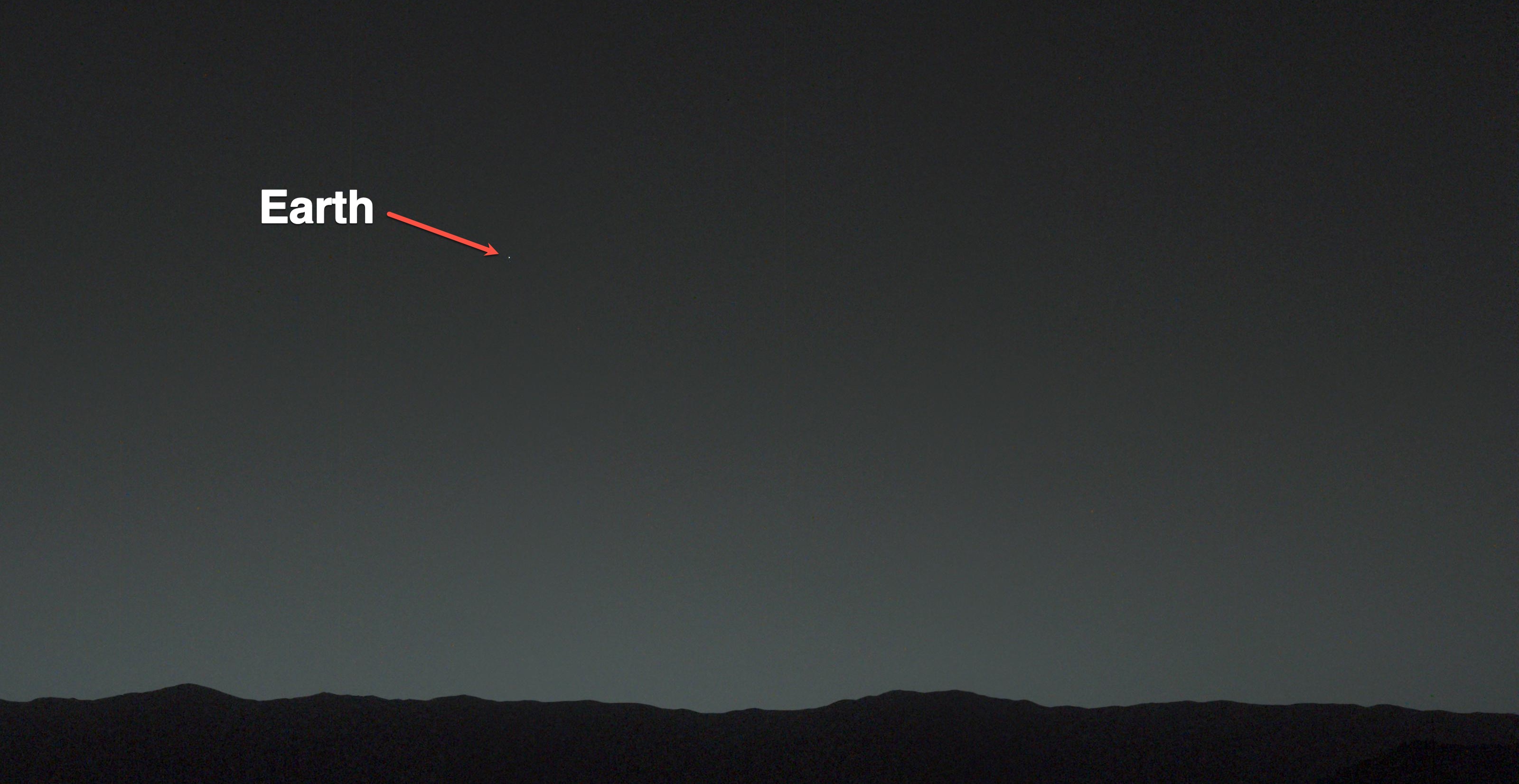 This view of the twilight sky and Martian horizon taken by NASA Curiosity Mars rover includes Earth as the brightest point of light in the night sky. Earth is a little left of center in the image, and our moon is just below Earth.