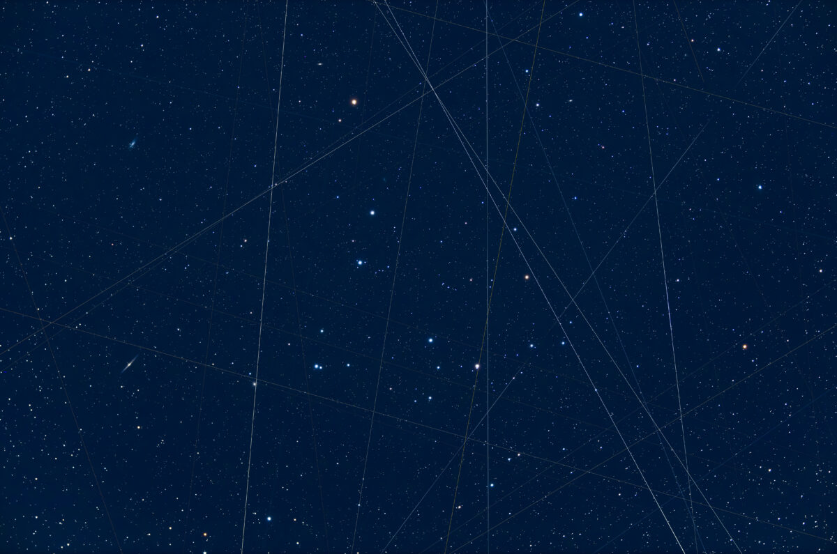Satellites and light pollution: Multiple satellites streak through this composite of the Coma Berenices cluster, shot through a wide-field telescope over the course of about an hour. The trails mostly run north-south, so the photographer posits they are due to polar-orbiting satellites, rather than the largely west-east tracks of Starlink.