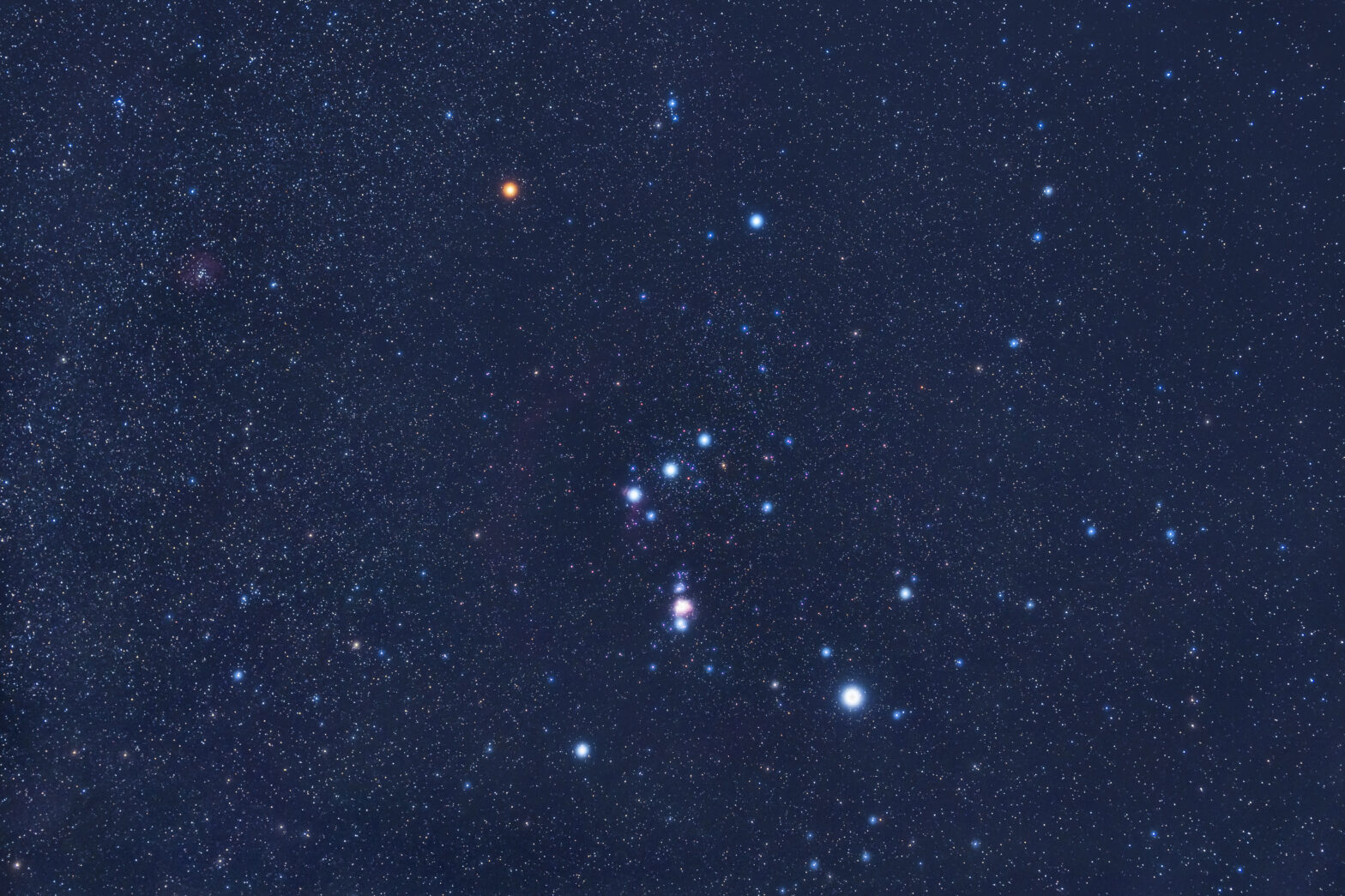 The constellation Orion the Hunter hosts two of the 10 brightest stars in the sky, Betelgeuse and Rigel. At magnitude 0.5 and 0.2, respectively, Betelgeuse (orange star at upper left) and Rigel (blue-white star at lower right) stand in stark contrast to many of the surrounding stars.