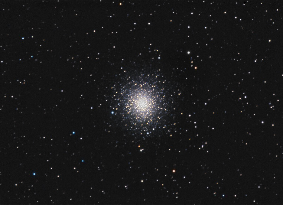 M2 features dark lanes arcing and branching across its northwest quadrant (lower right of this image) that can be seen visually through a telescope.