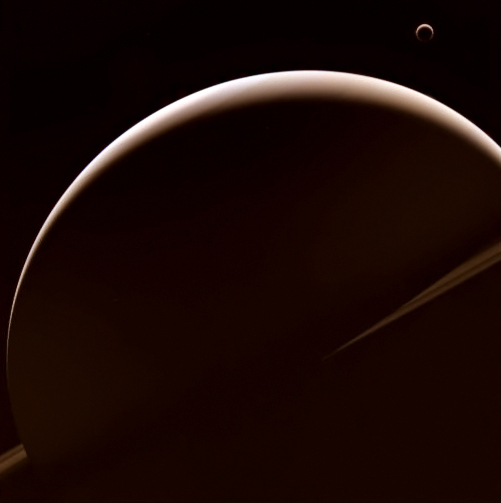 Titan and Saturn, imaged by Cassini