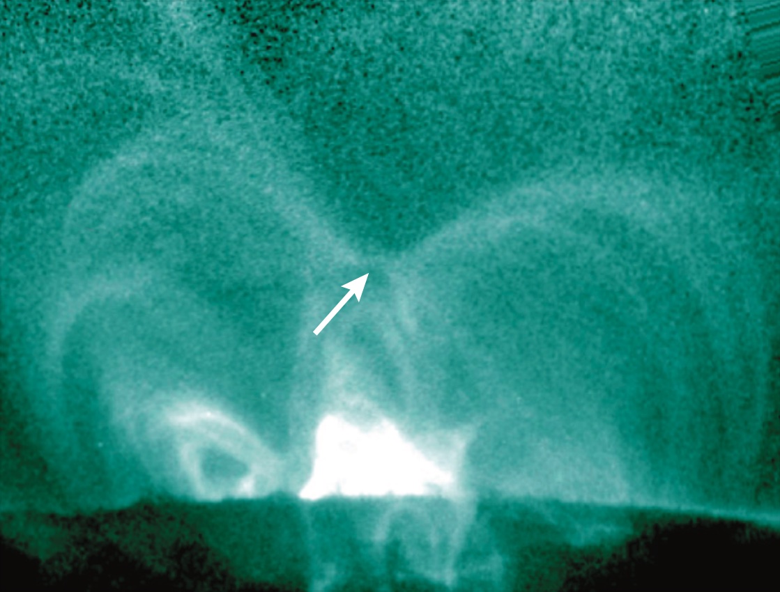 This close-up from SDO shows a coronal loop on the Sun just prior to a magnetic reconnection event in April 2014. Visible is the null point, which looks like the cross of an X, where the magnetic field strength drops to zero and reconnection can occur.