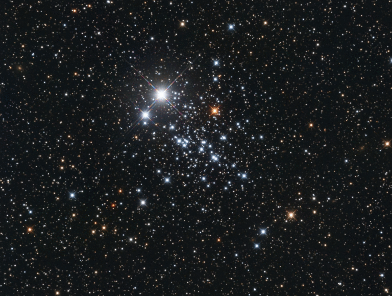 A collection of blue and orange and white stars against a deep black background