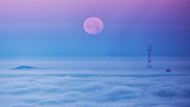 Moon setting over clouds of San Francisco
