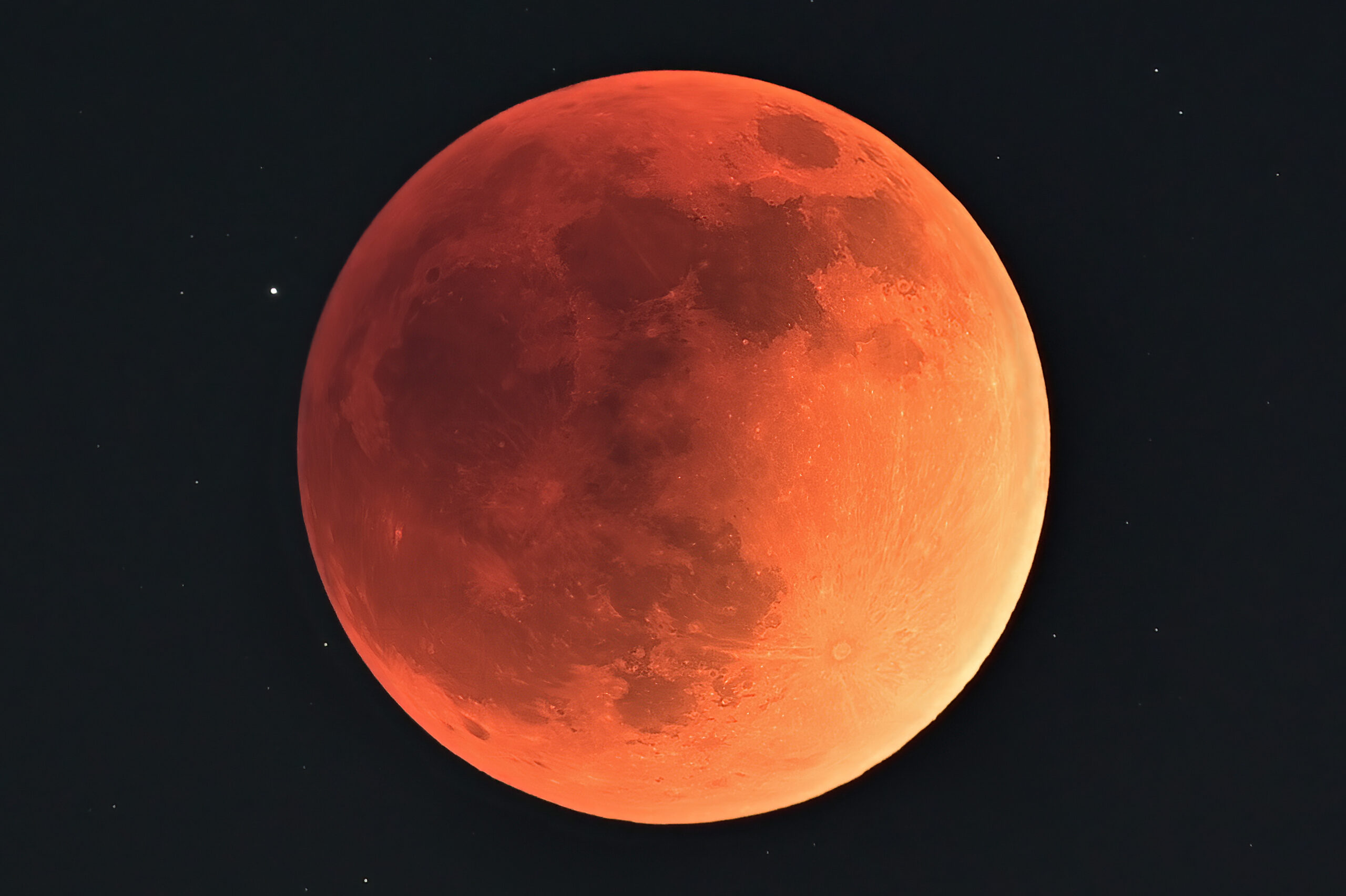 Why does the Moon turn red during a lunar eclipse?