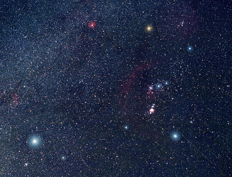 Orion and neighboring winter constellations photographed against a starry sky