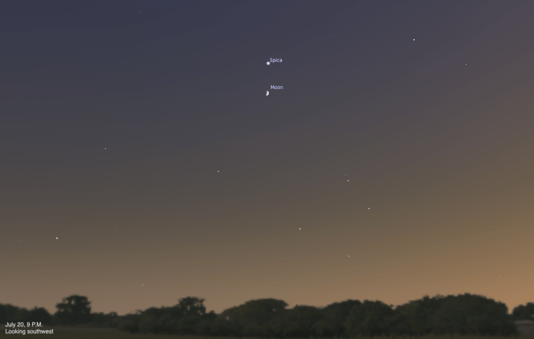 A simulated evening sky looking southwest on July 20, 2026, at 9 P.M. A thin crescent Moon is visible near the center of the frame, with the bright star Spica just above it. The sky fades from deep blue at the top to a warm orange glow near the tree-lined horizon.
