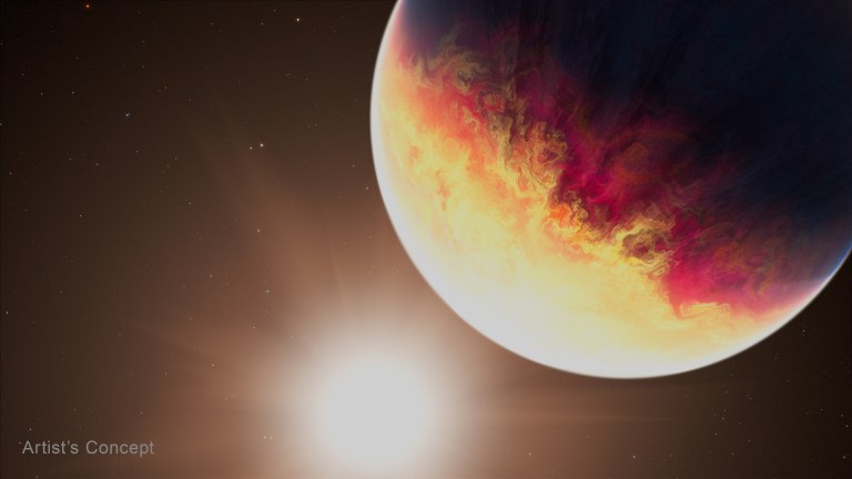 A large planet occupies the upper right of the frame, its surface swirling with bright orange, yellow, and deep red clouds on its sunlit side, fading to dark blue-black on its shadowed edge. Below and to the left, a bright white glow from a nearby star washes out part of the lower frame, set against a dark brown sky scattered with faint stars.