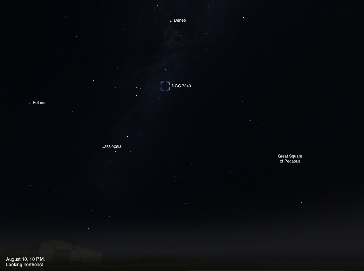 A sky chart showing the northeastern sky on August 10, 2026, at 10 P.M. The open star cluster NGC 7243 is highlighted with a dashed blue box near the center of the image. Deneb is labeled above it, Polaris to the left, Cassiopeia below and to the left, and the Great Square of Pegasus to the lower right. A faint band of the Milky Way is visible near the top of the image.