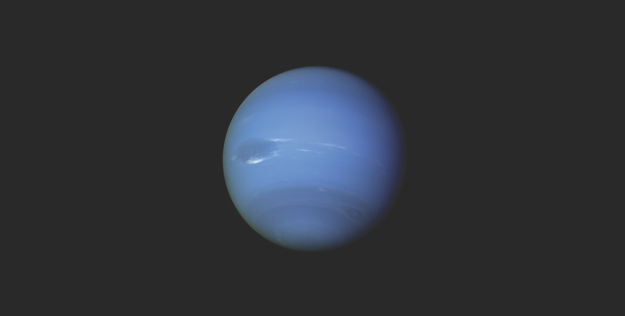 A pale blue Neptune centered against a dark gray background, showing faint darker banding and a bright wispy cloud feature near its equator.