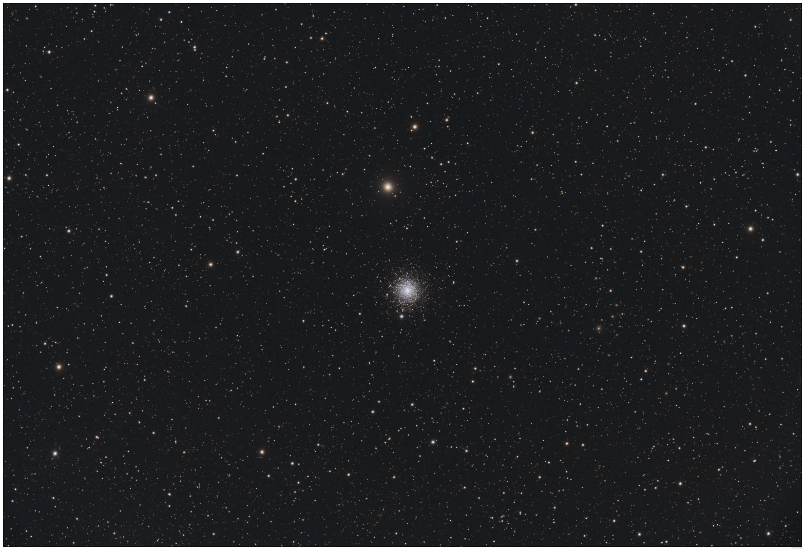 A telescopic photograph of M30, a globular cluster appearing as a compact, dense ball of white and blue-white stars near the center of the image, with a bright yellow-orange foreground star visible just above it. The cluster is set against a black sky scattered with numerous orange, yellow, and white foreground stars of varying brightness.