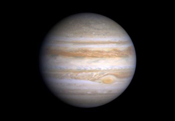 Io and Ganymede cast their shadows on the jovian cloud