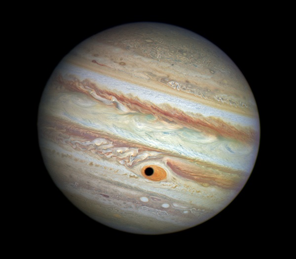 Ganymede's shadow crosses the face of Jupiter