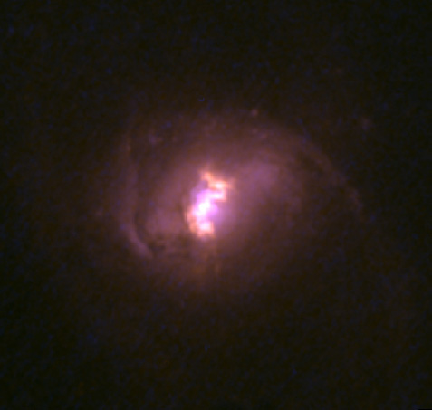 A Hubble Space Telescope color image of one of the nine galaxies targeted by NuSTAR. 