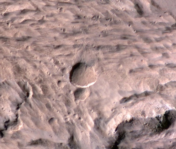 A new Mars crater spans half the length of a football field.