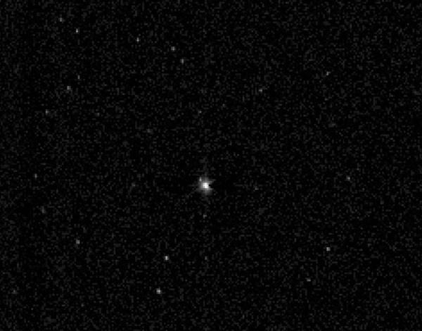 NASA's Pluto-bound New Horizons spacecraft captured this view of the giant planet Neptune and its large moon Triton July 10, 2014.