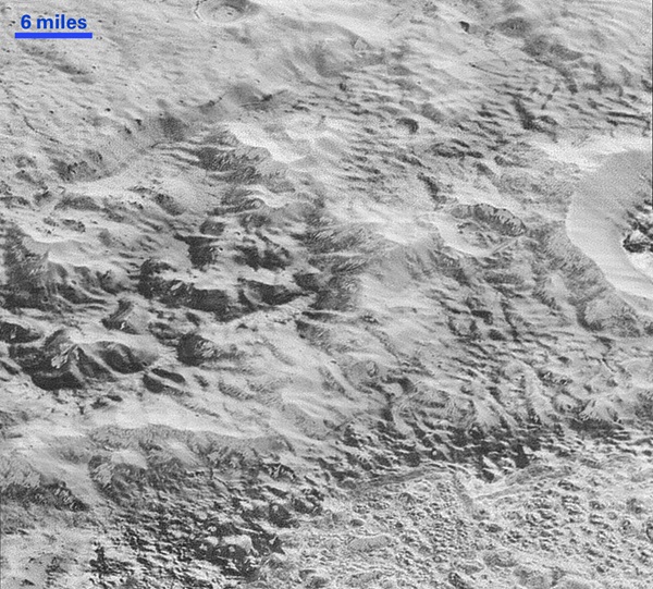 Erosion and faulting has sculpted portions of Pluto’s icy crust into rugged badlands. 