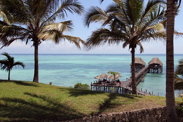 The warm tranquil waters of the Indian Ocean lap at the sandy beaches that surround Zanzibar.