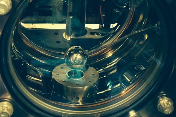 An aluminum sphere (center) helped suppress dark energy fields called “chameleon fields.”