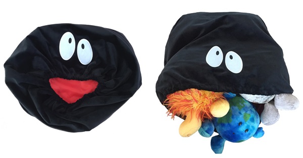 A picture of the celestial buddies black hole plush with plush planets inside