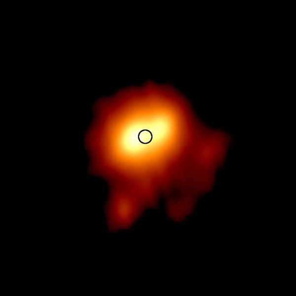 In this new image of the outer atmosphere of the red supergiant Betelgeuse, the colors represent brightness ranging from faintest (red) to brightest (white). The black circle represents the visual size of the star. Credit:  Royal Astronomical Society/e-MERLIN