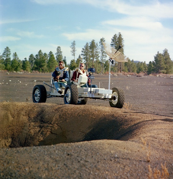 Dave Scott and Jim Irwin train for their mission by exploring an artificial crater field created by geologists to mimic a lunar landscape near Cinder Lake in Arizona.