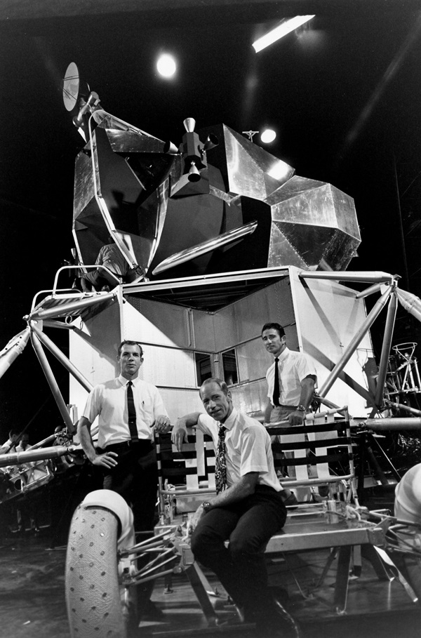 From left to right, Dave Scott, Al Worden, and Jim Irwin pose with a lunar rover simulator in Houston.