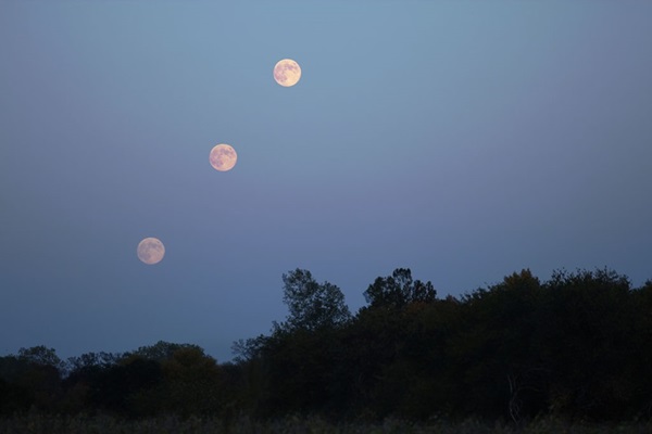 A sequence of three images showing the Harvest Moon rising