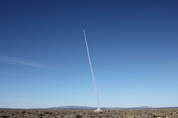 A rocket soars over the sea of sagebrush that blankets Brothers, Ore.