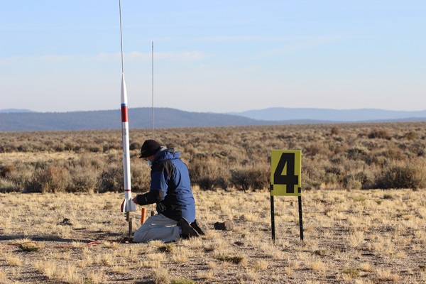 Gary Lech prepares his ARCAS rocket for an early morning launch.