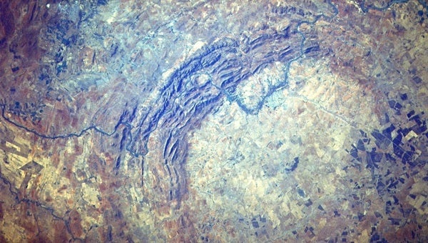 The Vredefort Dome is what remains of a meteorite impact 2 billion years ago. The full crater, which has since eroded away, has a diameter of about 190 miles (300 kilometers).