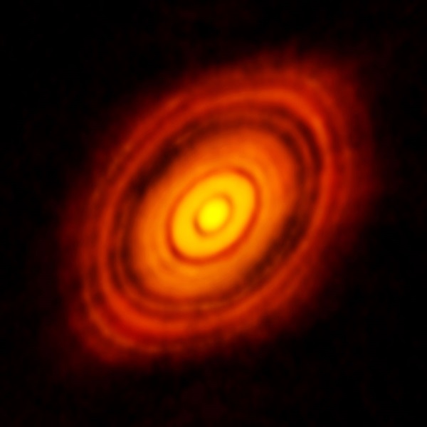 Planets forming within an accretion disk carve out gaps in the disk, revealing their presence.