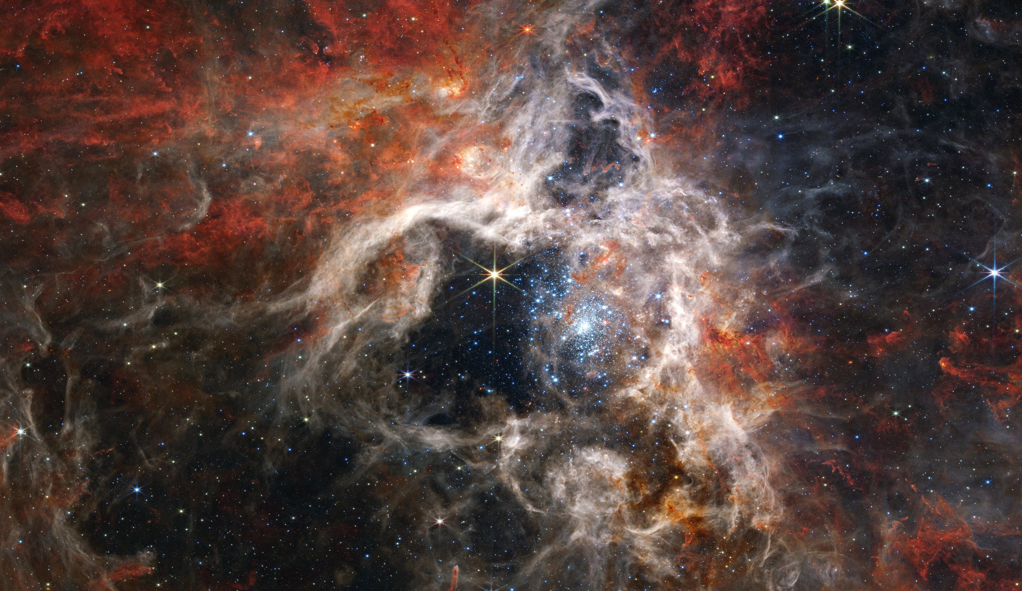 Cosmic Clouds Part to Reveal Dazzling Space Fireworks