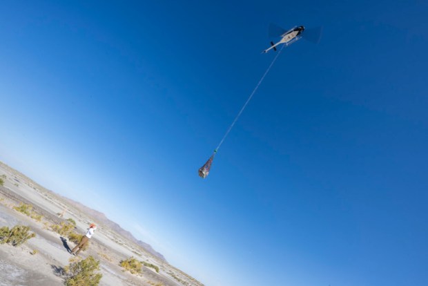 Helicopter transporting OSIRIS-REx sample