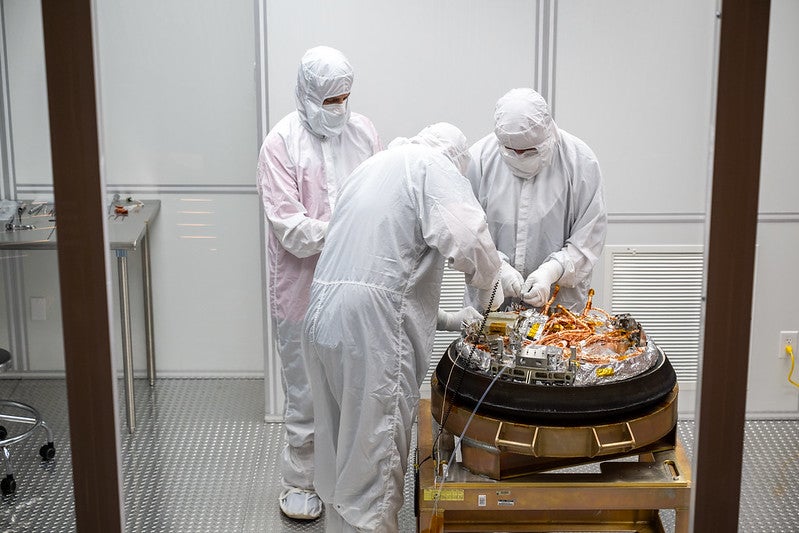 Clean room staff processing OSIRIS-REx sample