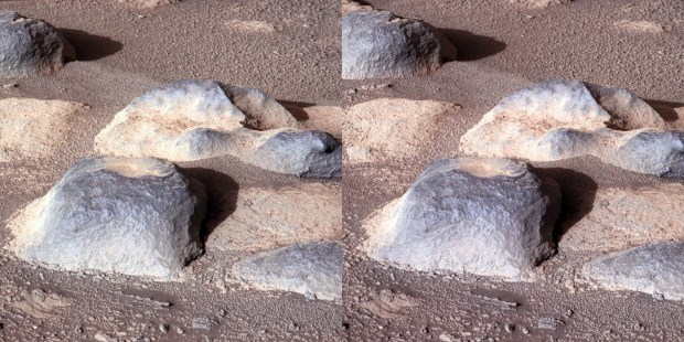 This fascinating cluster contains particularly smooth rocks that were most likely sculpted by martian winds and sands. The bigger rock in the foreground harbors a cavity on top.