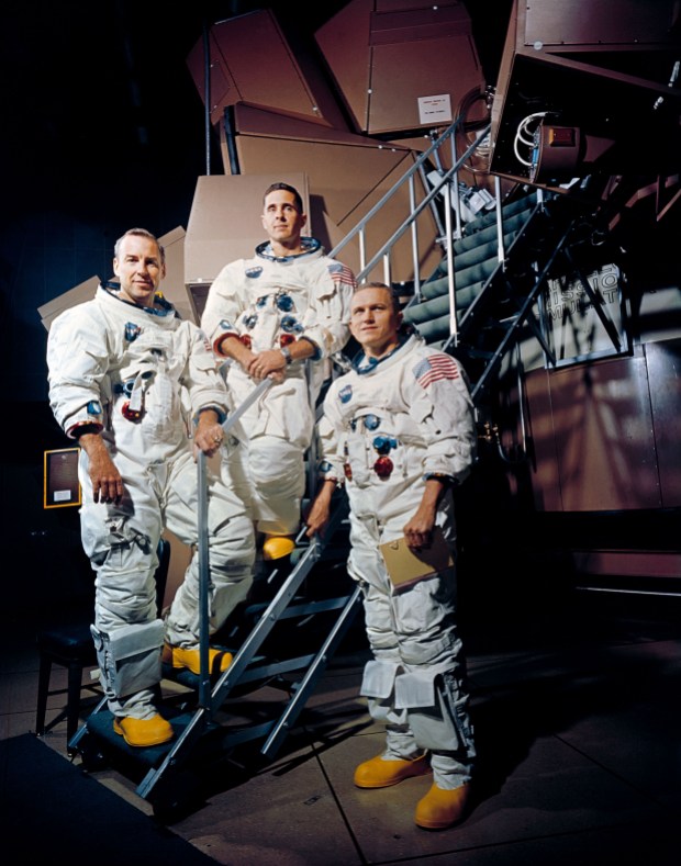 The crew of Apollo 8 pose outside a simulator at the Kennedy Space Center. From left to right: James A. Lovell Jr., William A. Anders, and Frank Borman.