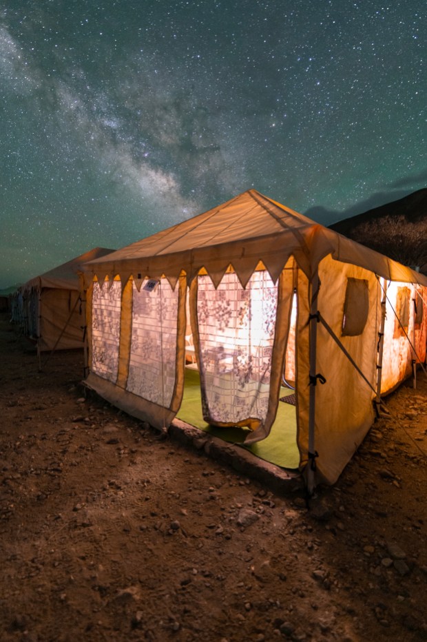 At an altitude of 13,862 feet (4,225 m), Pangong Tso in eastern Ladakh is one of the highest lakes in India. This photo shows the Sagittarius Arm of the Milky Way over the Heritage Camp tents where the group stayed for the night. Mukherjee used a Nikon Z6 II mirrorless camera and Tokina 16–28mm lens for the single shot.