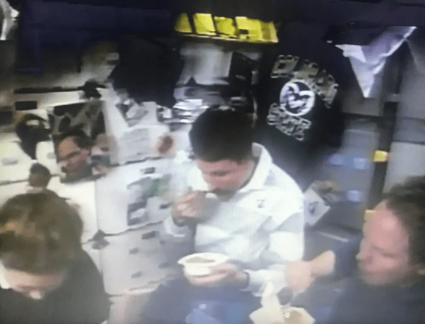 Astronauts Tamara E. Jeringan, Kent V. Rominger, and Thomas D. Jones on Columbia's middeck, enjoy a Thanksgiving meal in 1996. (Credit: NASA)