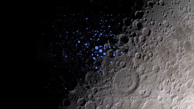 Some dark craters on the Moon, indicated here in blue, never get light. Scientists think some of these permanently shadowed regions could contain ice. NASA's Goddard Space Flight Center