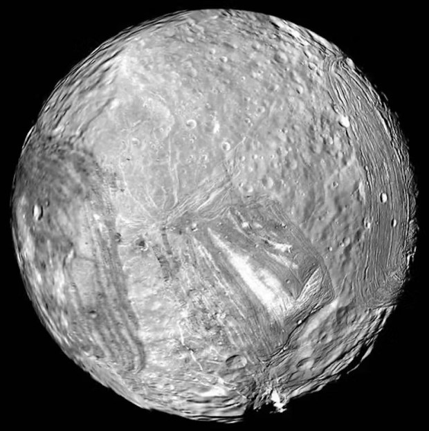 A cratered world of varied landscapes, Miranda is a Uranus moon that might be an ocean world. Credit: NASA/JPL-Caltech
