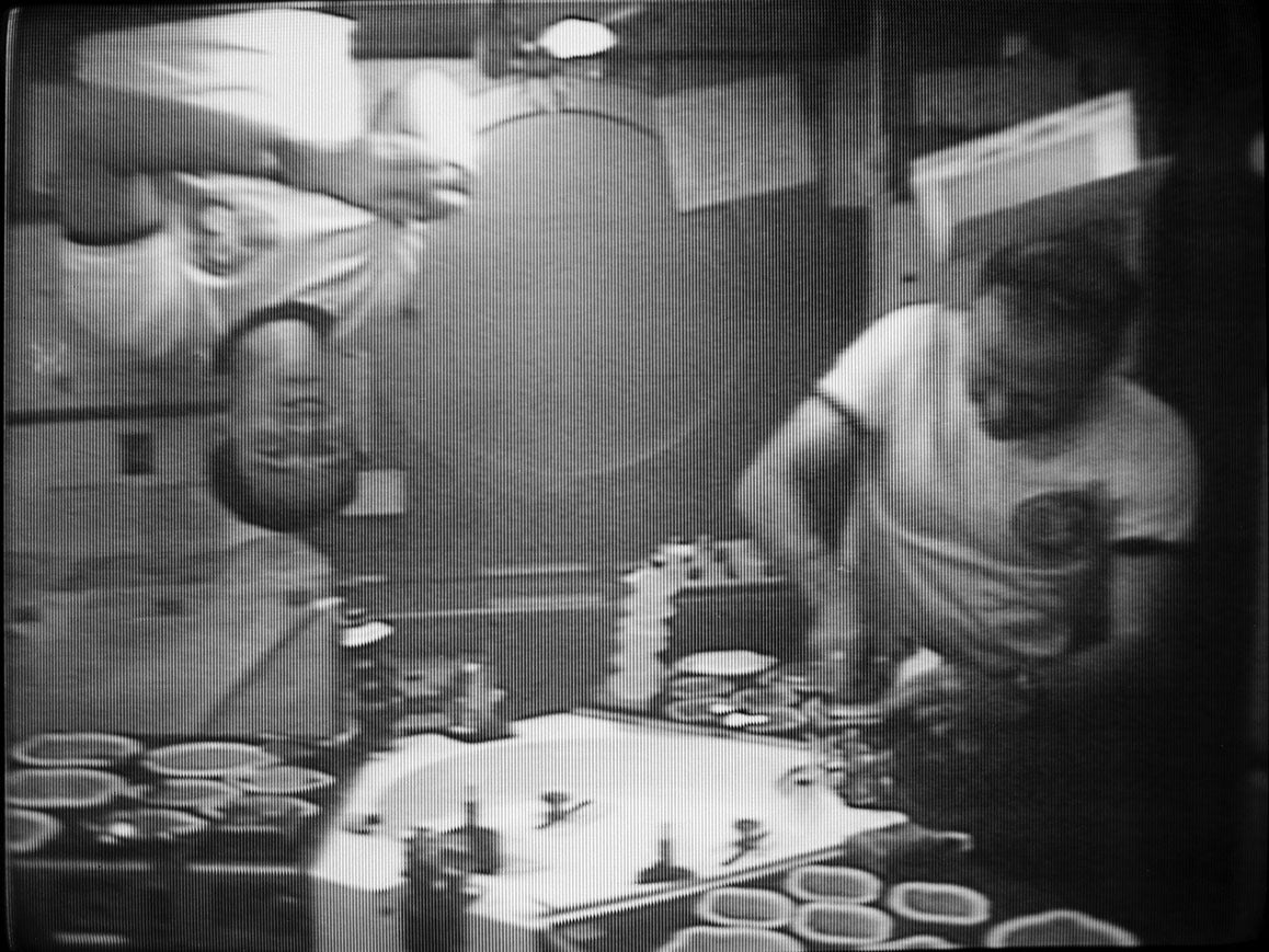 Astronauts Gerald P. Carr, Edward G. Gibson, enjoy Thanksgiving in space on SkyLab 4. (Credit: NASA)