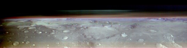 This unusual view of the horizon of Mars was captured by NASA’s Odyssey orbiter using its THEMIS camera, in an operation that took engineers three months to plan as part of the space mission. It’s taken from about 250 miles above the Martian surface – about the same altitude at which the International Space Station orbits Earth. Credit: NASA/JPL-Caltech/ASU.
