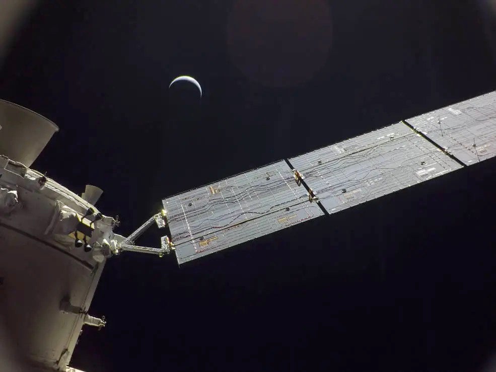 The Orion spacecraft photo of itself with the moon in the distance. Credit: NASA