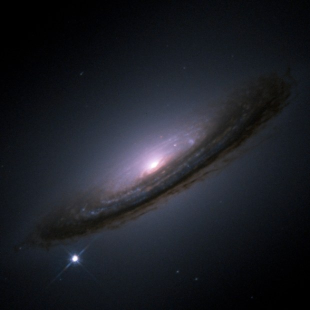 SN 1994D in NGC 4526 was a type Ia supernovae imaged here by the Hubble Space Telescope. Credit: NASA, ESA, The Hubble Key Project Team, and The High-Z Supernova Search Team
